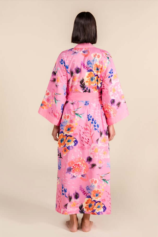 Back view of Cherry Blossom Cotton Robe with floral design, showcasing hibiscus and cherry blossoms on a pink background.