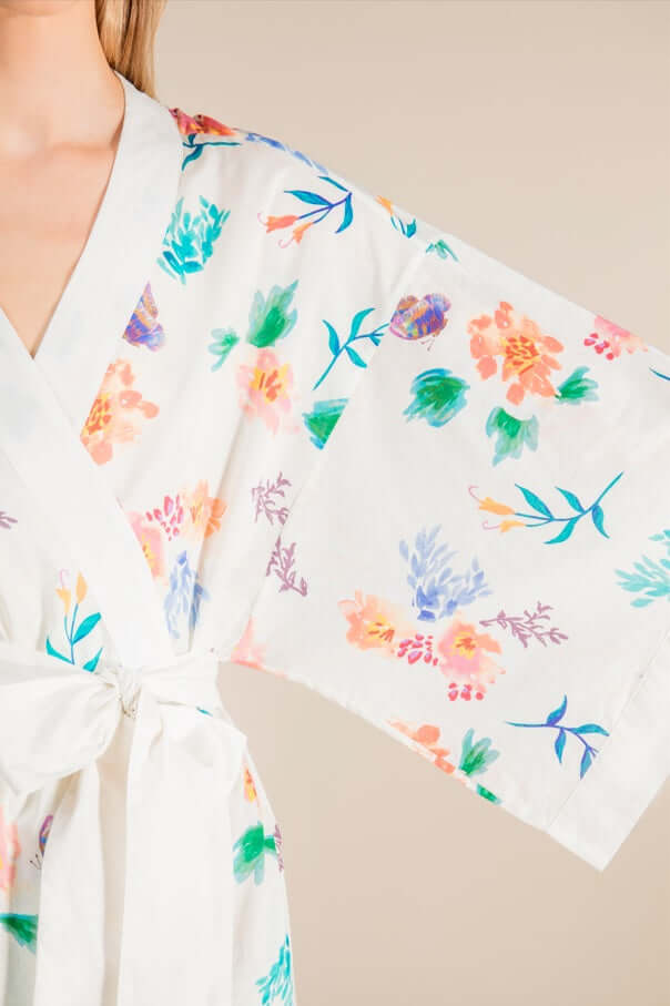 Jasmine Cotton Robe with floral print, ivory fabric, short length. 100% cotton, lightweight and breathable for luxury and comfort.