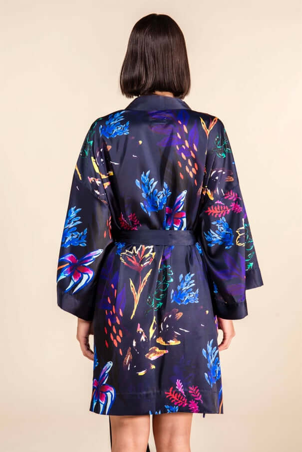 Back view of the Chicory Silk Satin Robe with colorful floral patterns on a navy base.