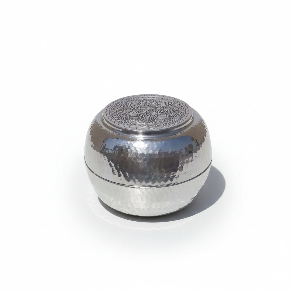 Engraved Silver Box with intricate patterns, round shape, and luxurious aluminum finish, perfect decorative accent for elegant storage.