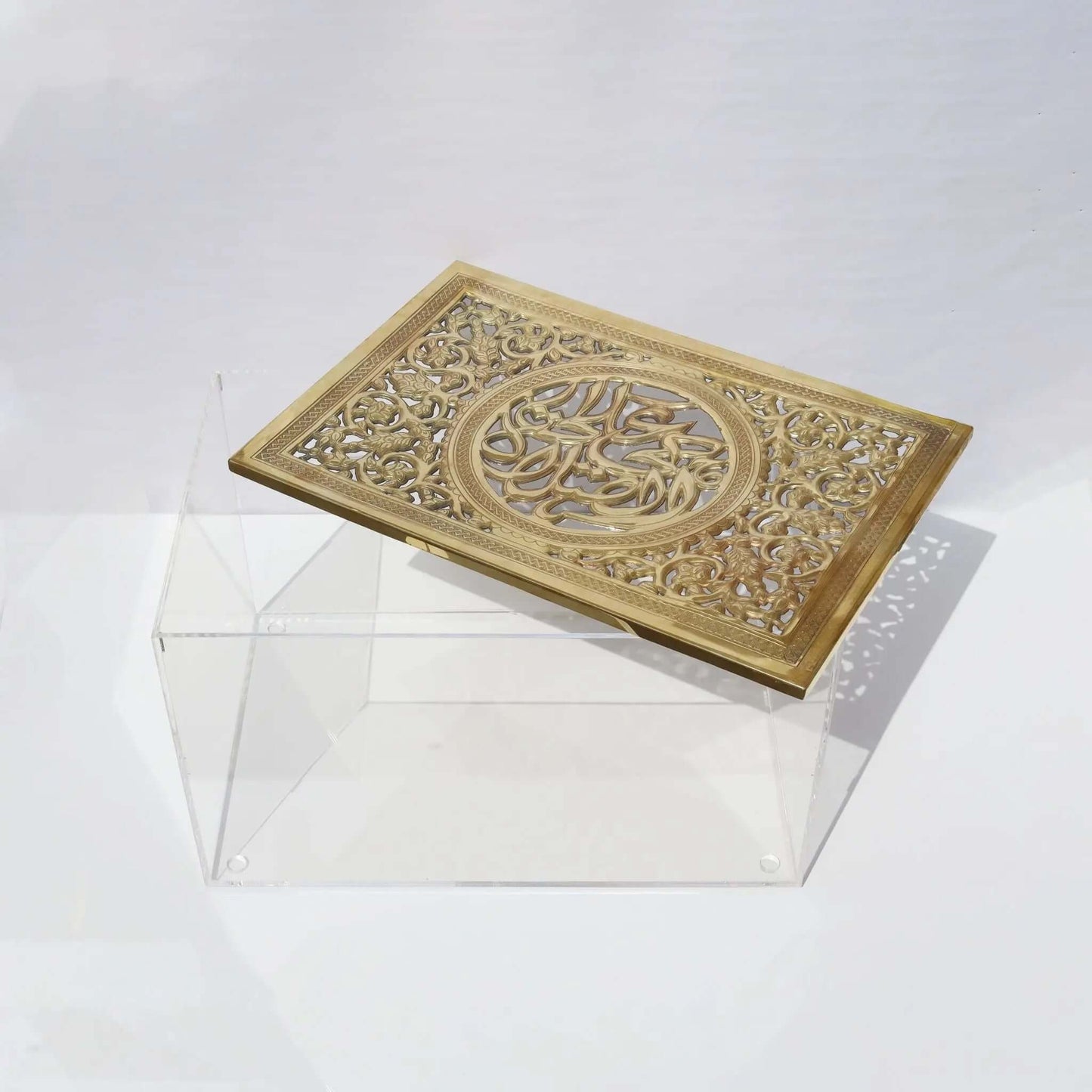 Rectangular prayer mat box with plexy base and engraved brass cover featuring Arabic calligraphy, elegant and spiritual design.