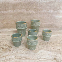 Load image into Gallery viewer, Beldi Cup Azza Plain Almond Green Gold Ceramic
